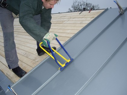 Zinken daken voor De Oude Haven in Huizen