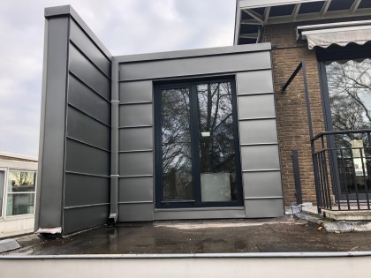 Traditionele gevelbekleding van zink of koper